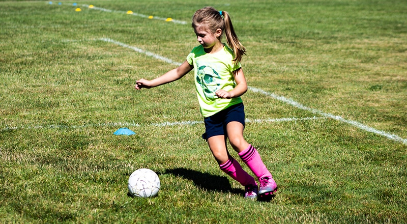 little girl playing soccer